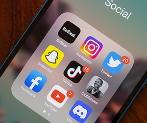 Phone showing TikTok and other social apps