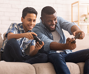 Parent and child playing video games